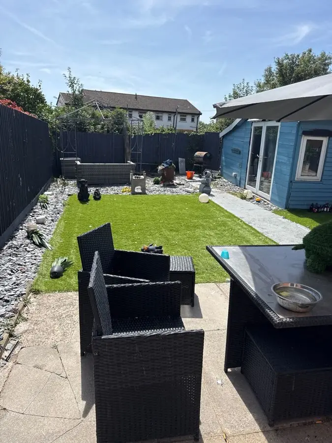 Water rill, outdoor sofa and grasses: the garden before