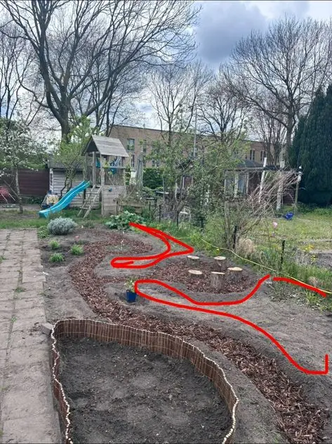 Family garden with a curved path and play area: the garden before