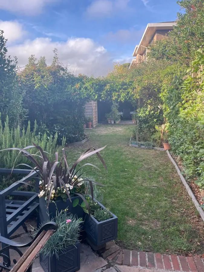 Gravel path to a bench: the garden before