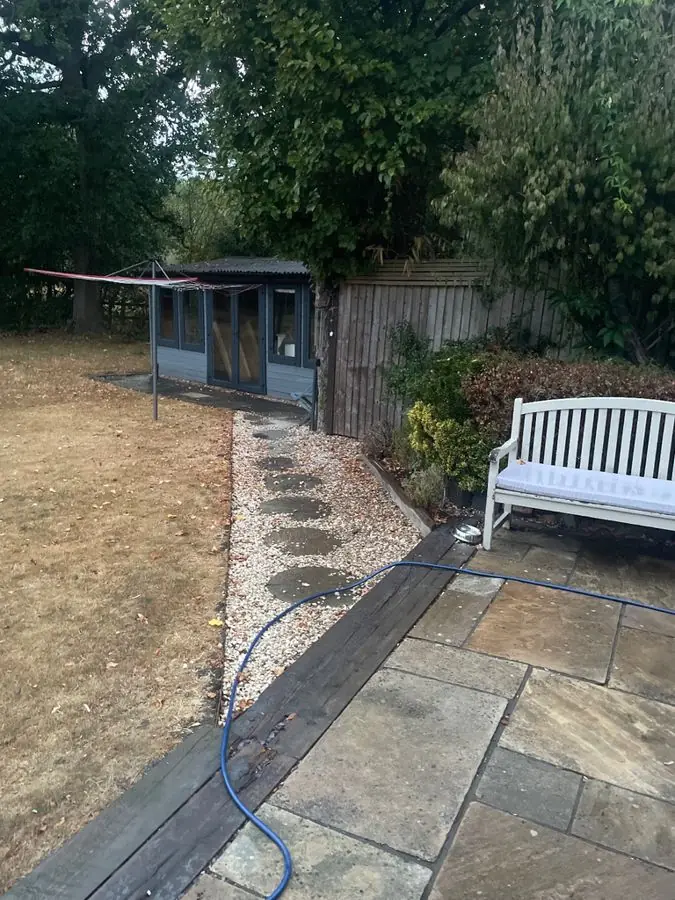 Patio and bench with cottage borders: the garden before