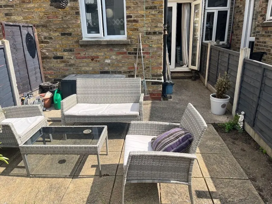 Terrace patio with clipped evergreens: the garden before