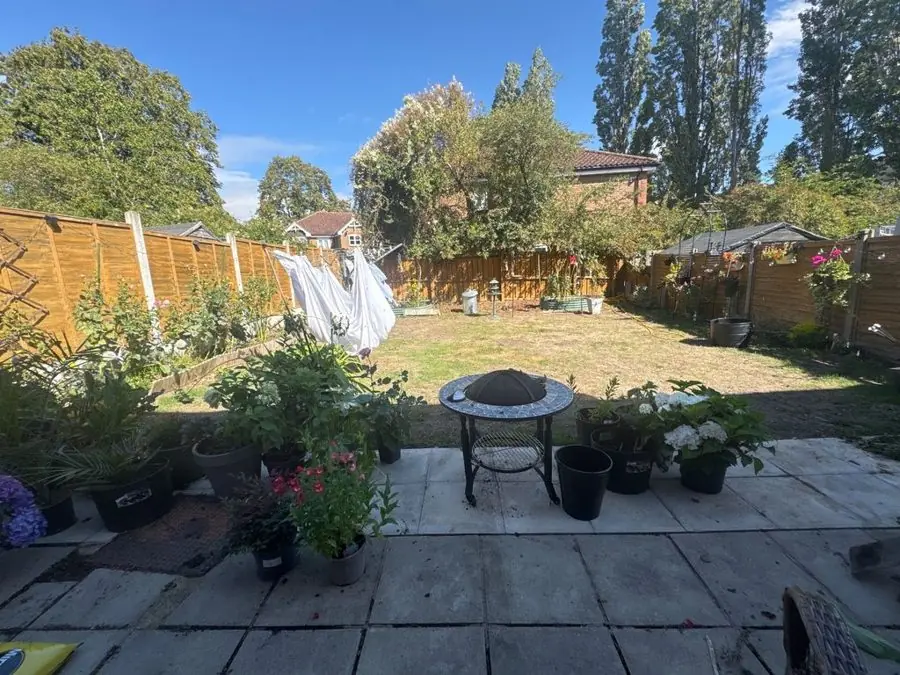 Fire pit circle in orange and gold: the garden before