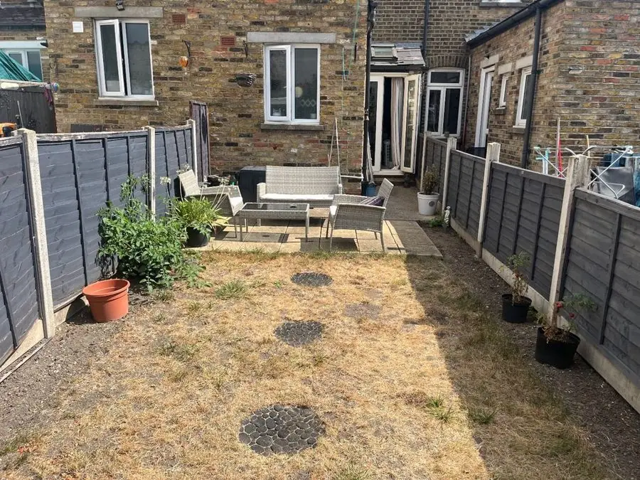 Terrace garden of flowers and paving: the garden before