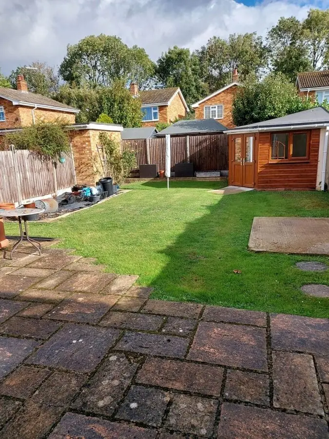 Sandstone terrace and a small lawn: the garden before