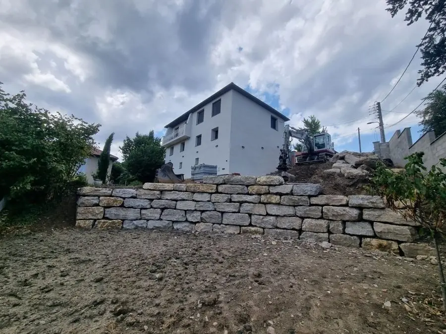Gravel path up a stony slope: the garden before