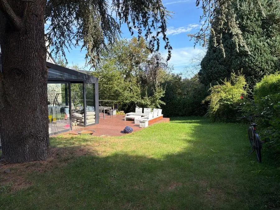 Amber and orange planting round a garden room: the garden before
