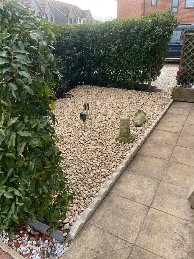 Raked gravel, lanterns and a stone water bowl: the garden before