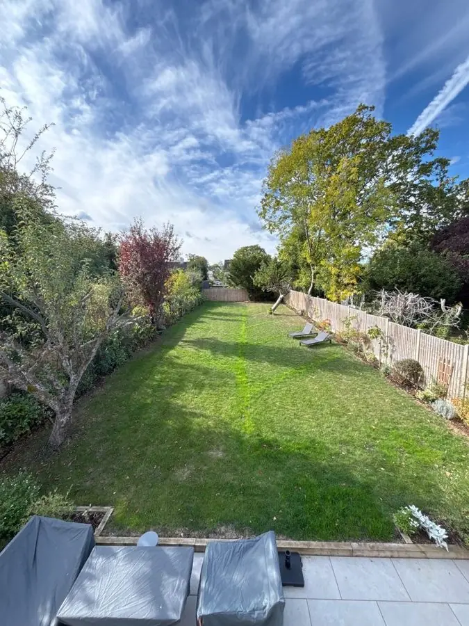 Long garden of winding paths and a pond: the garden before