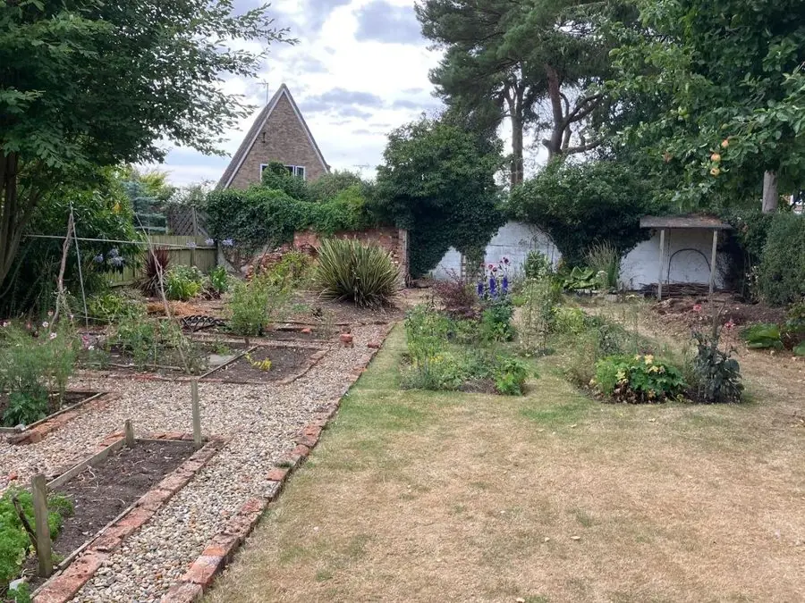 Lavender gravel garden by an A frame house: the garden before