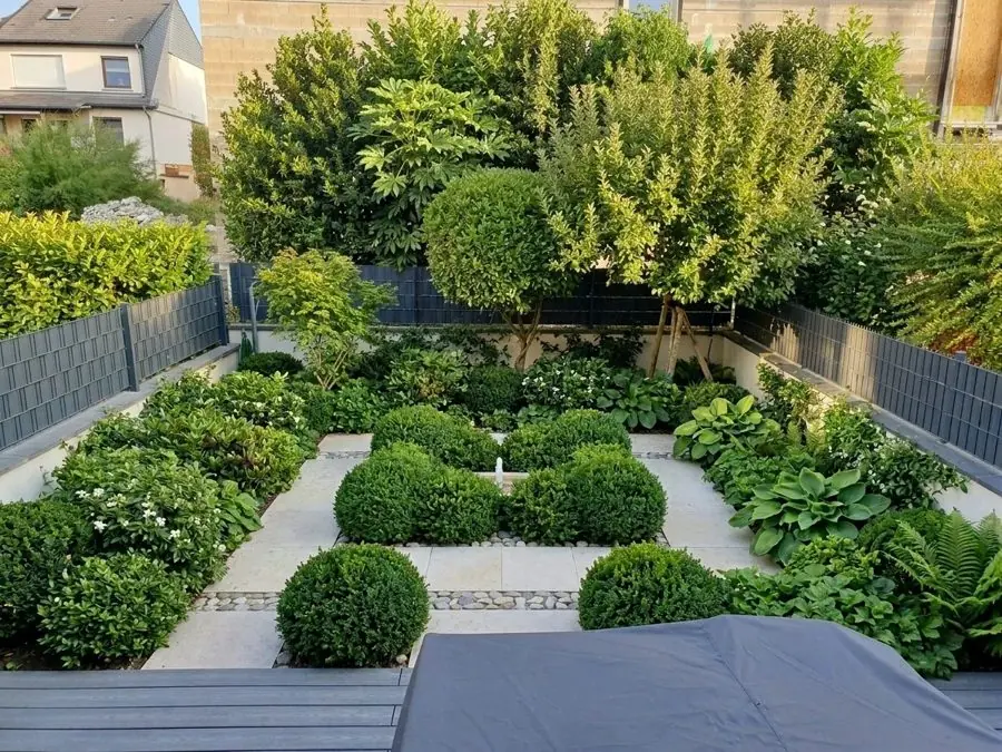 Box squares round a paved centre, an evergreen garden idea
