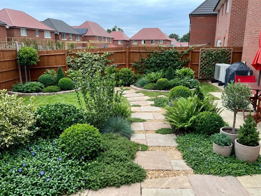 Clipped balls and a stone path, an evergreen garden idea