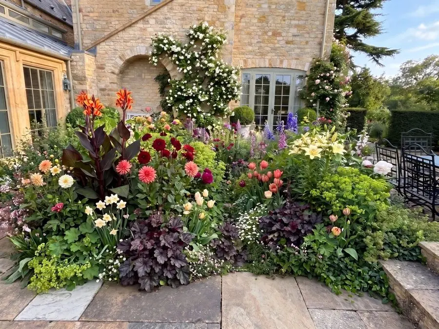 Dahlias and dark leaves by the terrace, redesigned