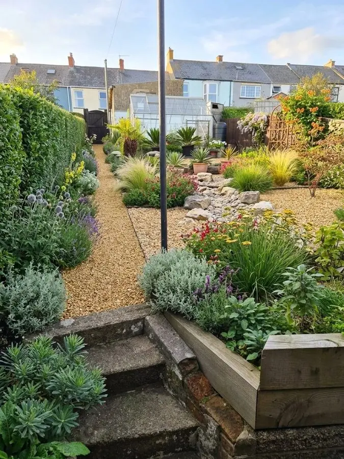 Gravel and grasses down the garden, redesigned