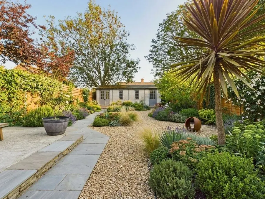 Gravel path past a cordyline, redesigned