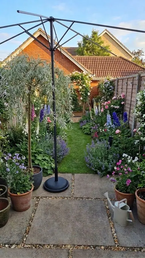 Patio and small lawn with cottage borders, redesigned with the app