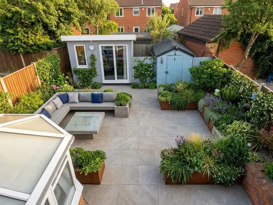 Patio with steel planters and a seating corner, redesigned