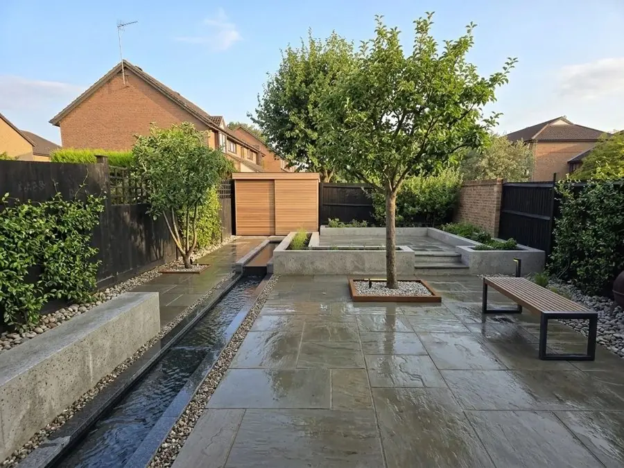 Paved garden with a rill and a tree, redesigned