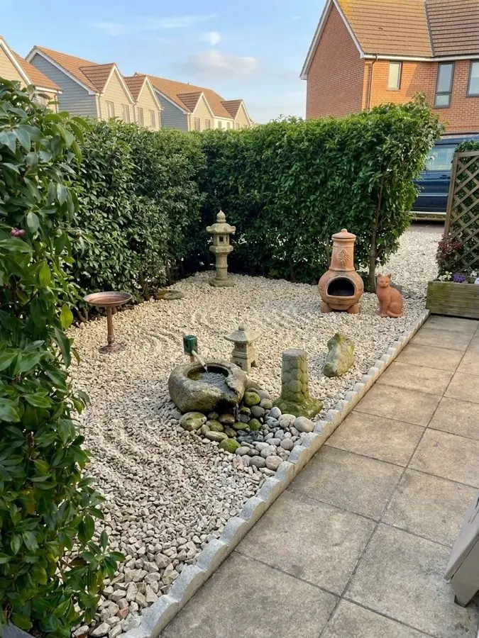 Raked gravel, lanterns and a stone water bowl, redesigned