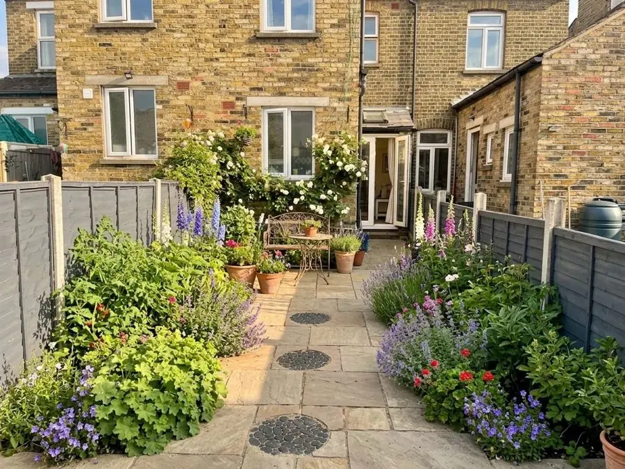 Terrace garden of flowers and paving, redesigned
