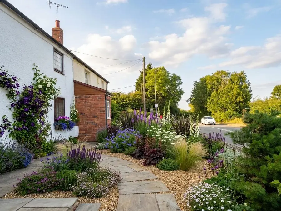 A flagstone path through flowers, planned with the garden planner app