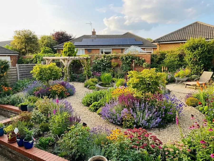 Gravel paths round island beds of lavender, salvias and rudbeckia, a planting design made with the app