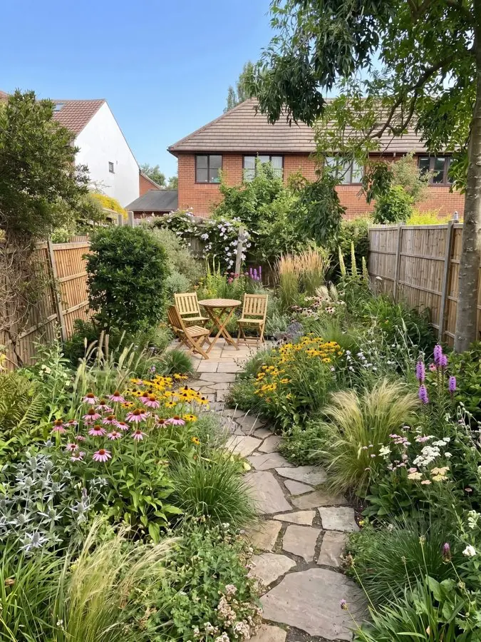 Stone path through coneflowers and grasses, a landscape design made from a photo
